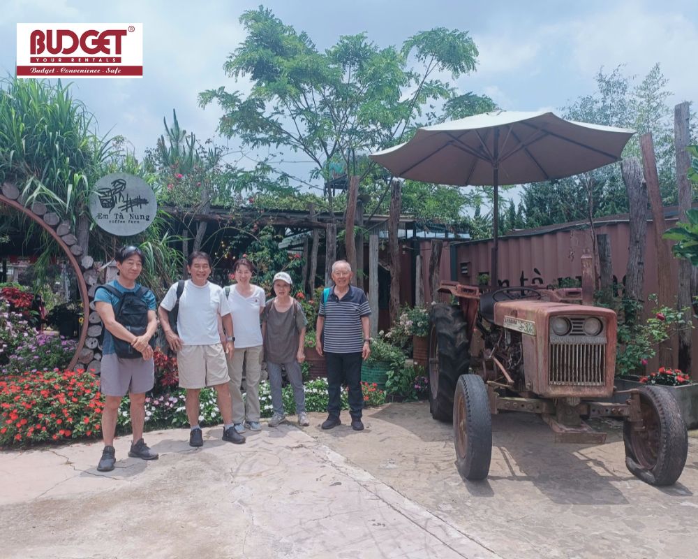 Taiwan-tourists-took-a-picture-together-next-to-a-vintage-tractor-at-Em-Ta-Nung-coffee