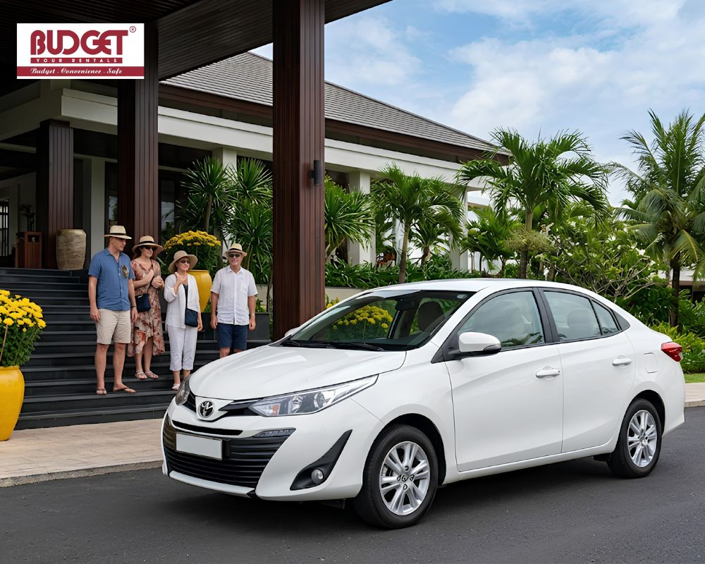 White-Toyota-Vios-arriving-at-a-luxury-resort-in-Mui-Ne-to-pick-up-international-vacationers-to-Da-Lat
