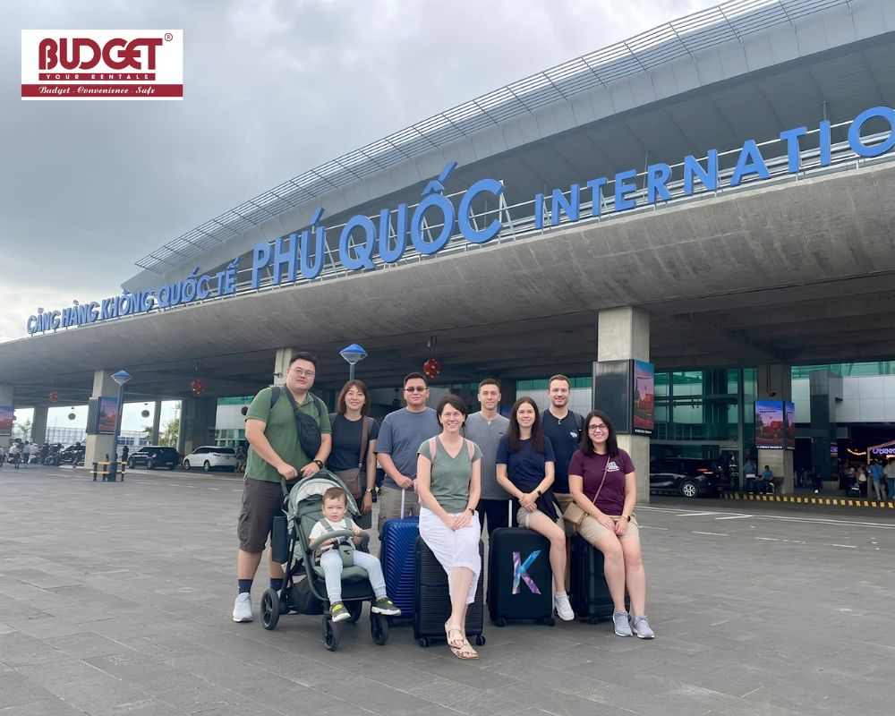 Group-of-international-travelers-took-a-photo-with-their-luggage-outside-Phu-Quoc-International-Airport