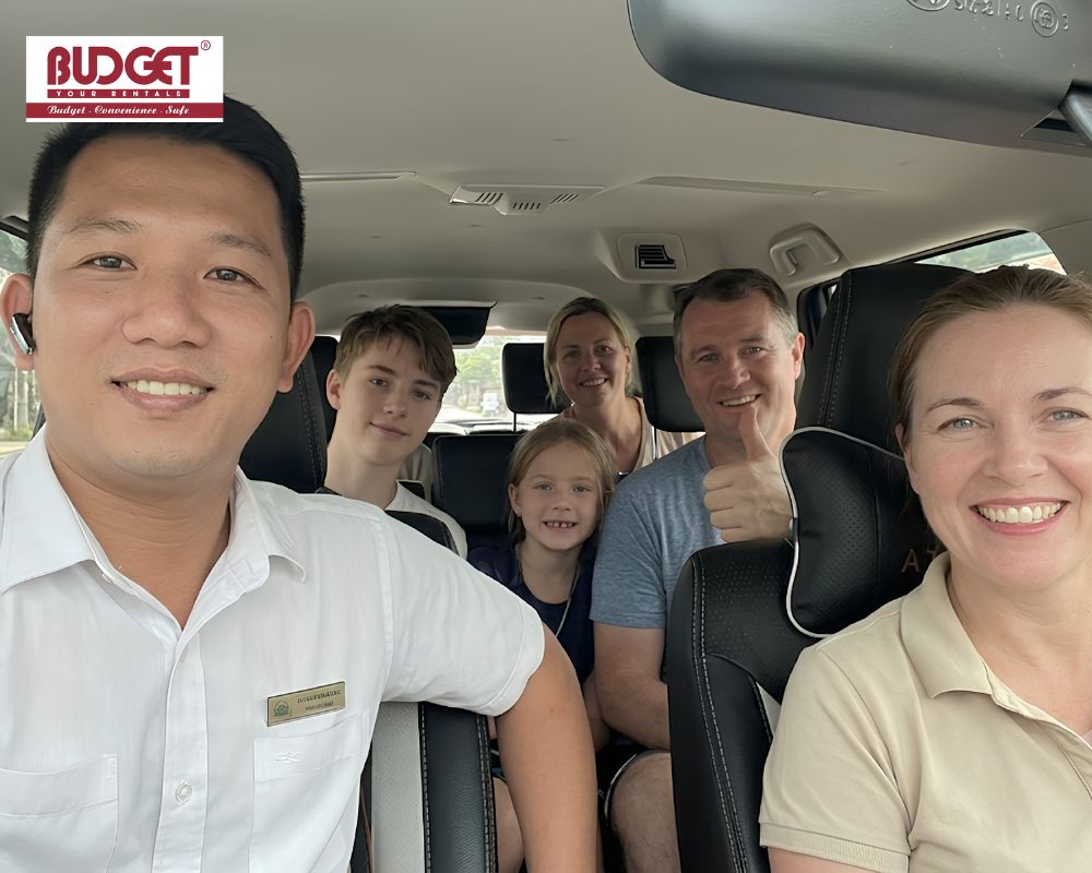 Our-driver-and-international-family-tourists-took-a-photo-together-inside-our-car