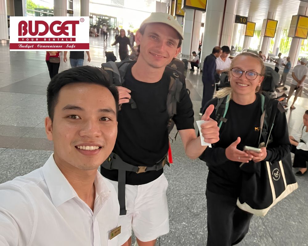 Our-driver-took-a-selfie-with-two-international-travelers-after-meeting-them-at-Noi-Bai-Airport