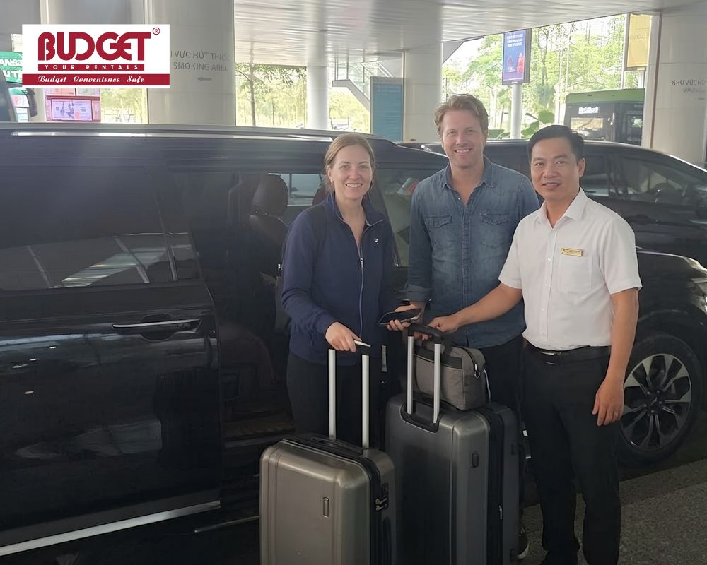 Our driver welcomed an American couple with their luggage next to our limousine at Noi Bai Airport