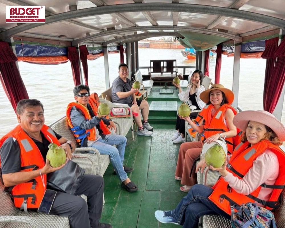 Visitors-relax-on-a-motorized-boat-trip-across-the-Tien-River