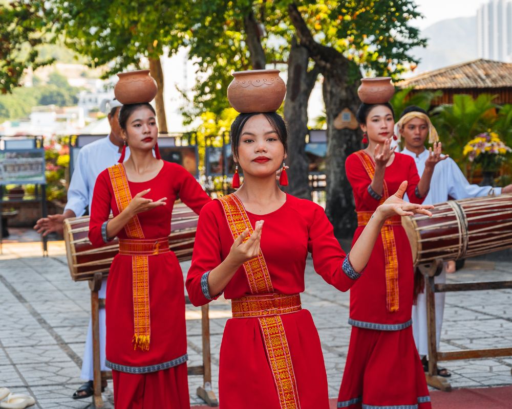 Girls in traditional dress dance at Po Nagar Cham Towers in Nha Trang