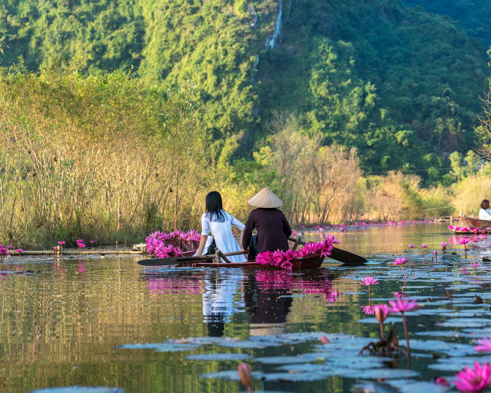 Yen Stream with traditional boat on the way to Huong Ancient Pagoda