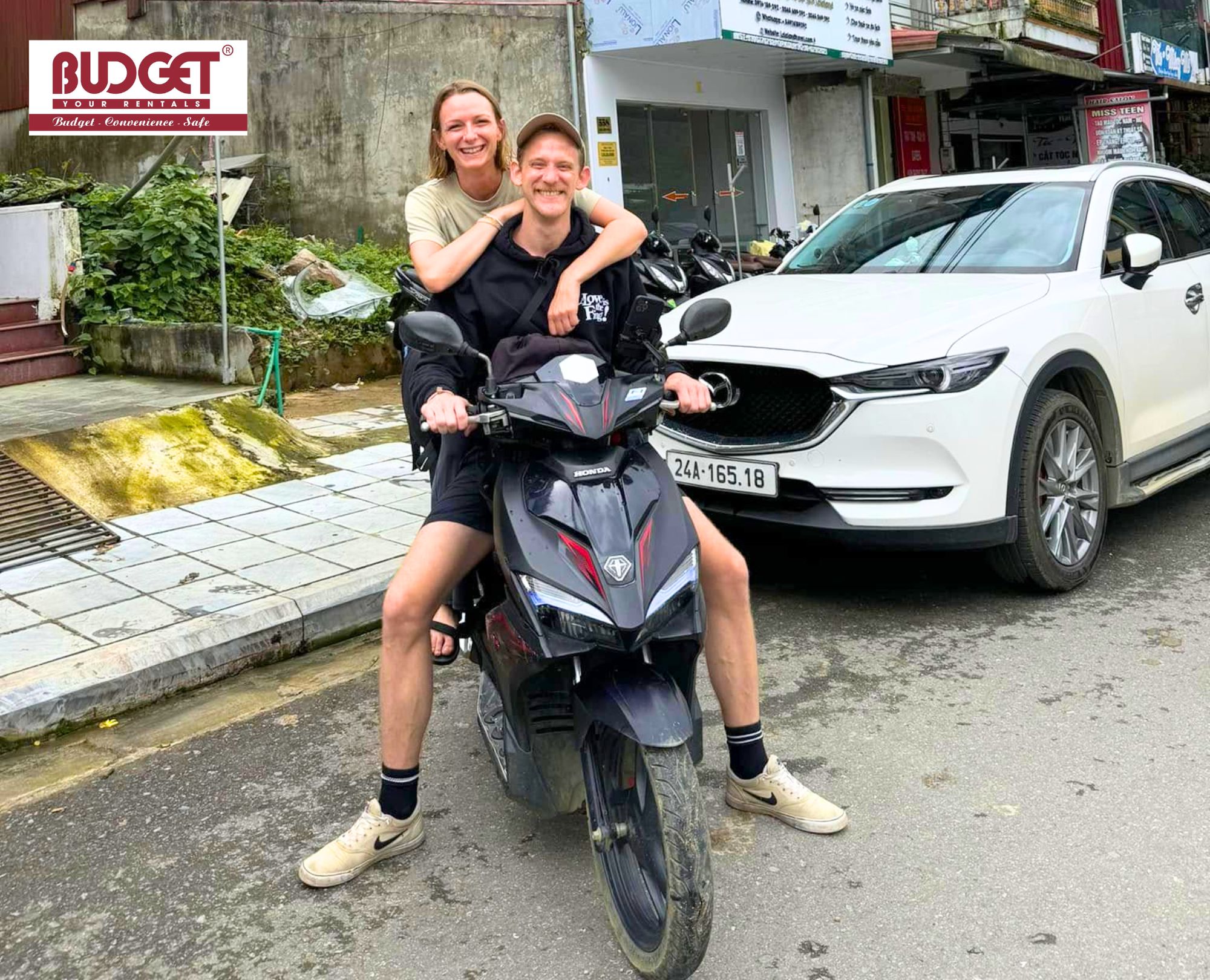Adventurous-couple-on-a-scooter-enjoying-their-independent-travel-freedom