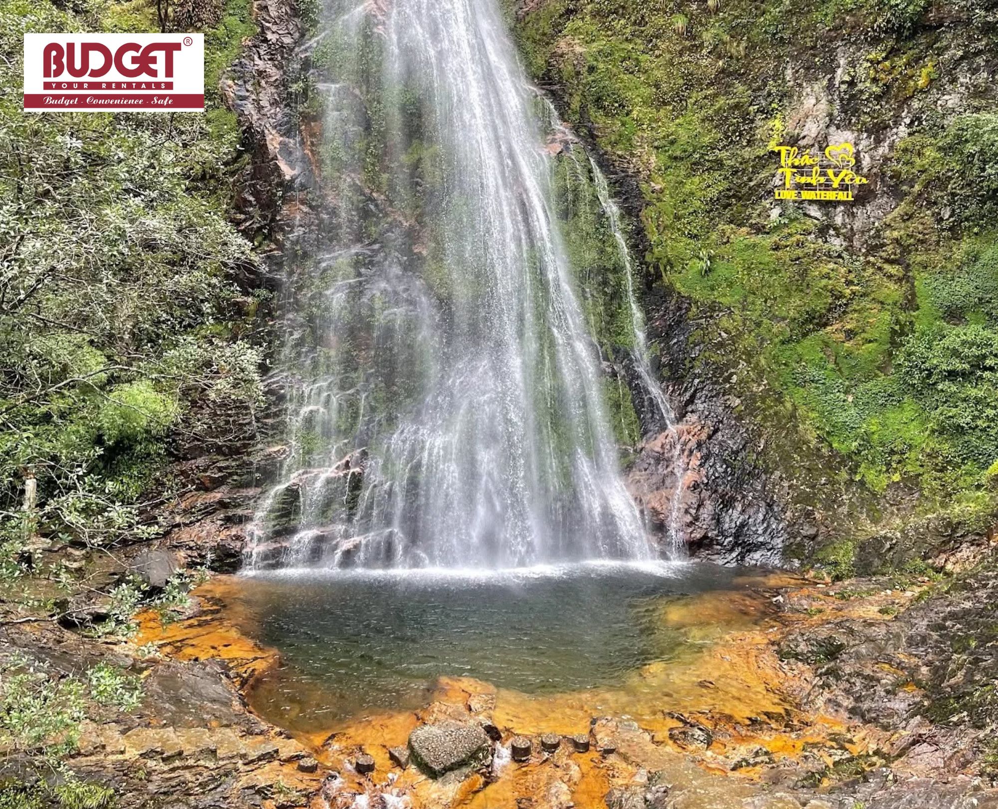 Stunning-natural-waterfall-that-cascades-down-high-rocky-cliffs-into-a-clear-pool