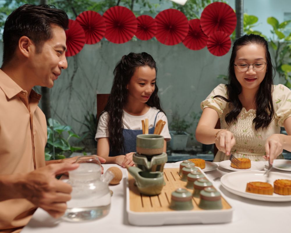 Family eating moon cake