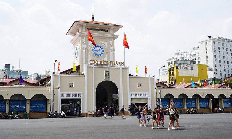 Taking selfie in front of Ben Thanh Market in Ho Chi Minh City