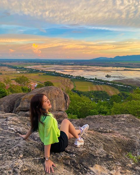 A girl sitting on Sam Mountain