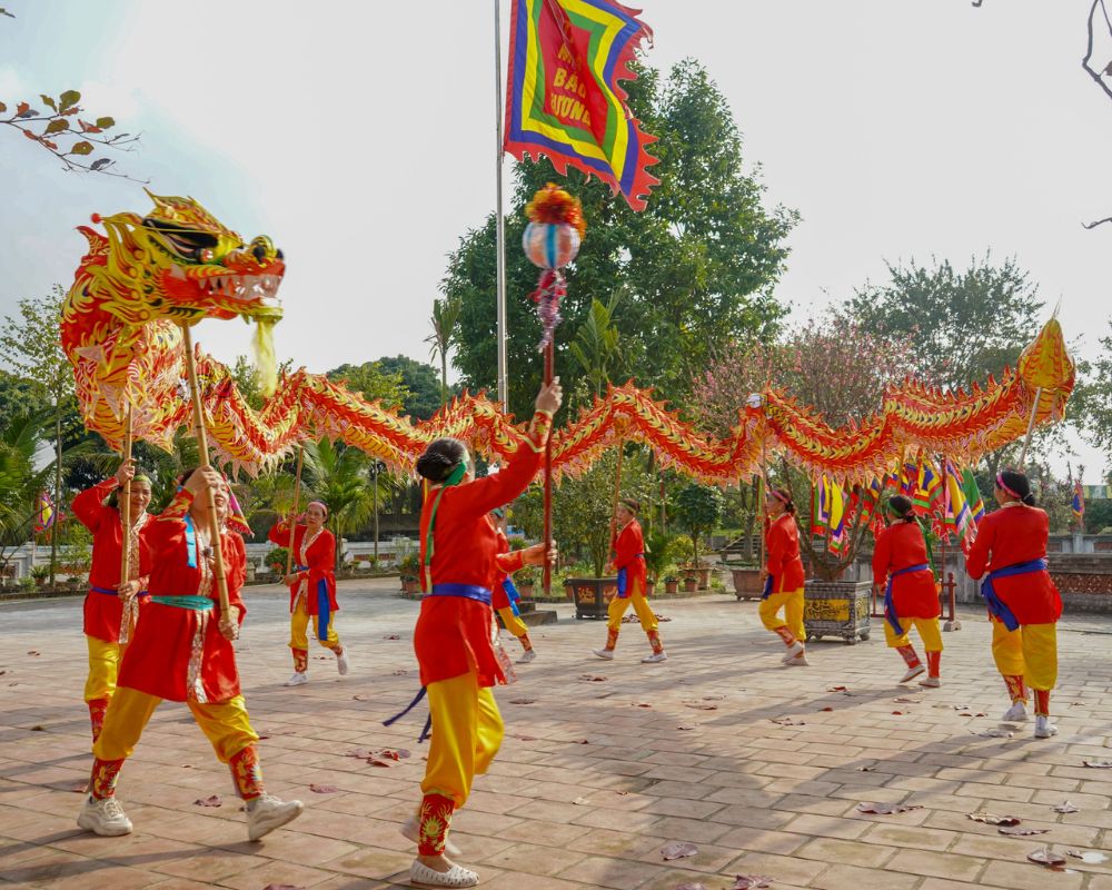 Performers reenacting Saint Giong's legend with dragon flag processions