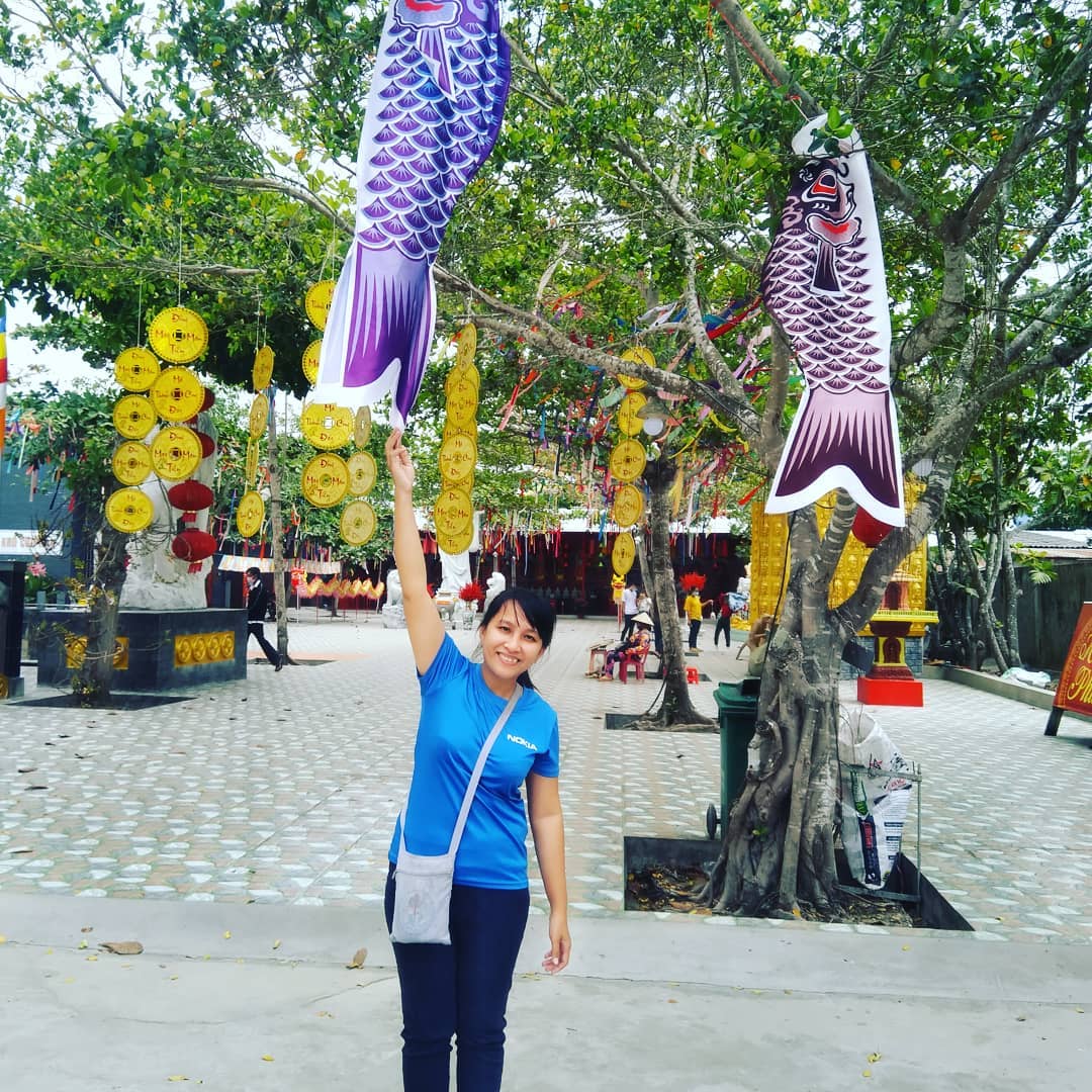 A girl taking photo at Quan Am Linh Ung Pagoda