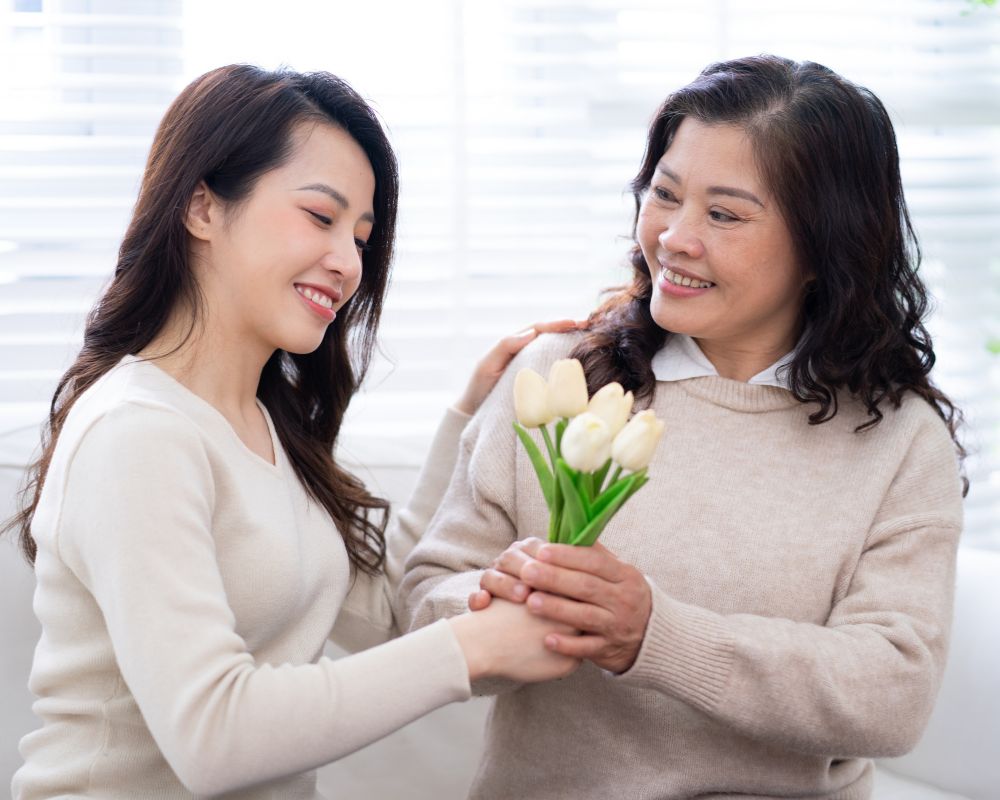 Daughter gives flowers for her mother