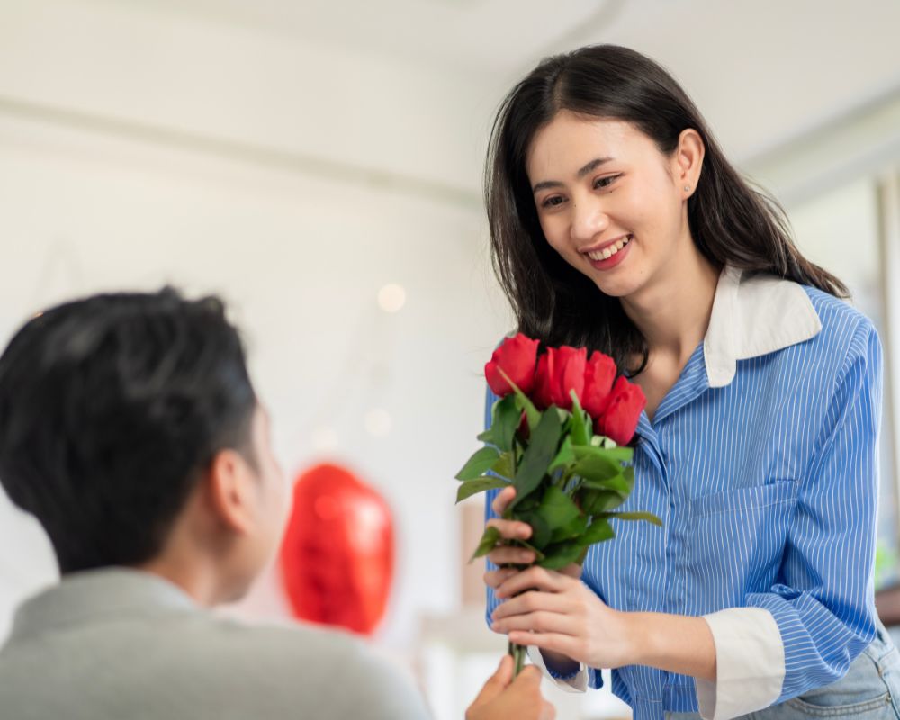 The boy giving flowers for his girlfriend in Women’s Day in Vietnam